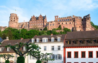 Heidelberg, mediaevial castle, red sandstone ruins tower looms majestically over the Neckar river and valley clipart