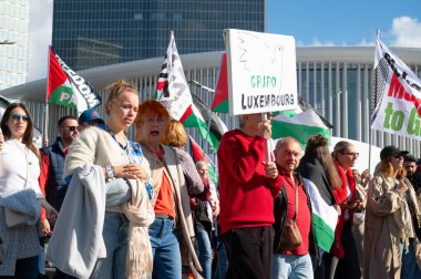 Gaza pro Palestine protest march at Kirchberg in Luxembourg city, Europe, solidarity demonstration, Israel and middle east war, palestinian flag, september 29th 2025