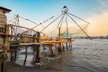 Chinese fishing nets, shore of Kochi, Kerala in India, Cheenavala or tangkul, traditional stationary lift net, industry