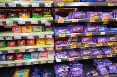Milka and Ritter Sport chocolate assortment at store shelves in supermarket in Trier, Germany, price increase, inflation, september 17th 2025