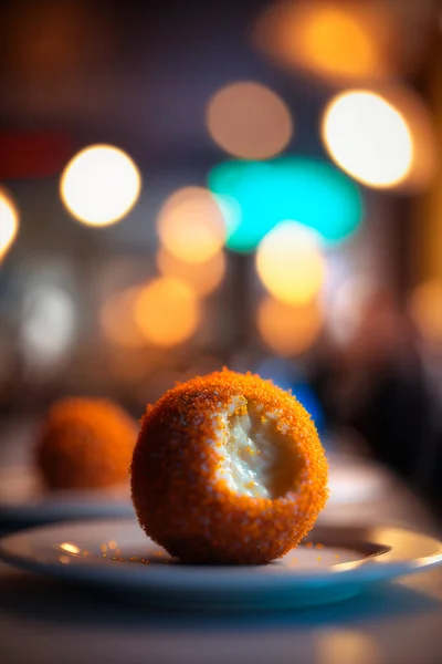 Indulge in the perfect blend of flavors with our authentic Italian Arancini balls. Made with love and traditional recipe, it's a perfect snack for anytime.