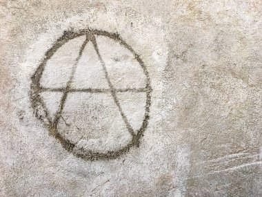Grungy anarchy symbol on wall. Ideal for textures, backgrounds and concepts. Space for text. clipart