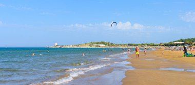 Vieste, Italy. View of the Scialmarino Beach with people on the beach and practicing water sports, on a Summer day, along the coast of Vieste. Banner header image. September 7, 2022 clipart