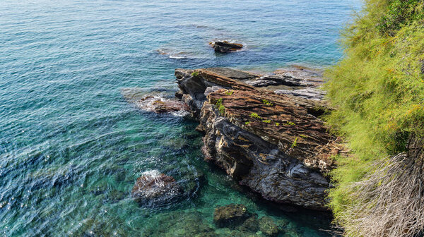 Nervi. Genoa, Italy. View of the sea from the top of a rock along the coast of Nervi, near Genoa. Transparent emerald sea on a sunny day, Mediterranean Sea in Liguria region.