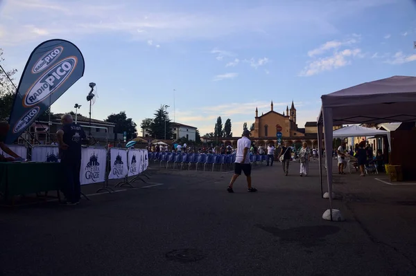 stock image Street painters at a convention while drawing sacred pictures on the asphalt at sunset