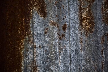 Iron wavy plate with rust on it seen up close