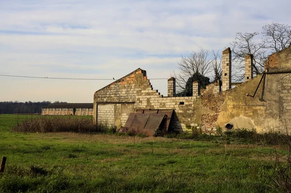 Abandoned country house in a field in the italian countryside