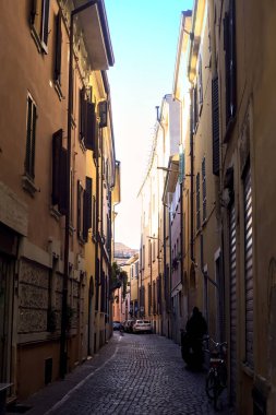 Narrow street in the shade in an italian town