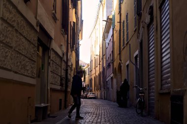 Narrow street in the shade in an italian town