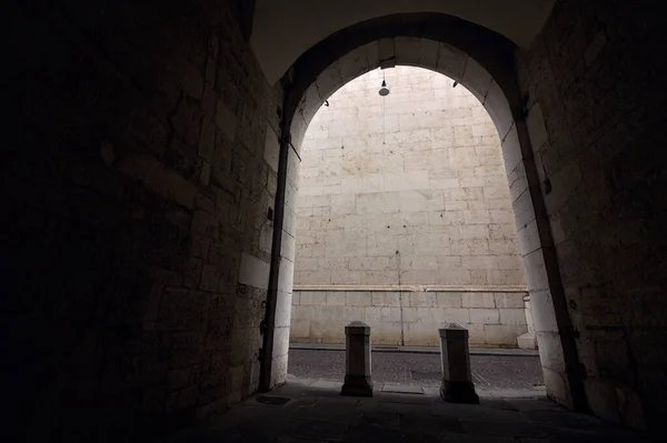 stock image Porch partly in the shade of a historical building in an italian city on a cloudy day