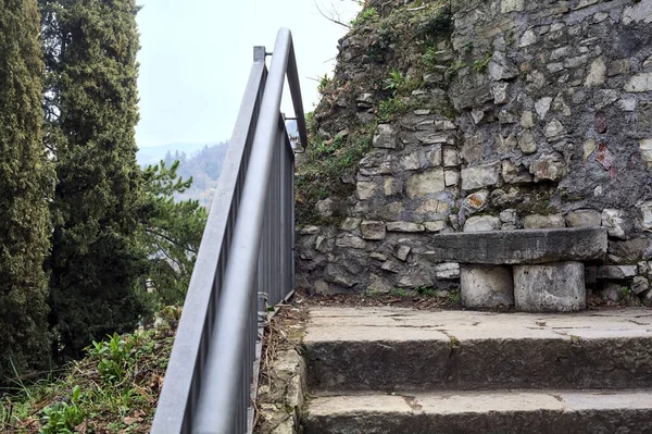 stock image Stone bench on a stone staircase in a park