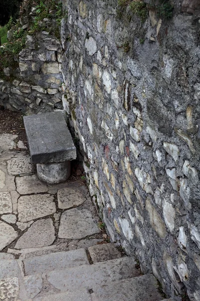 Stone bench on a stone staircase in a park
