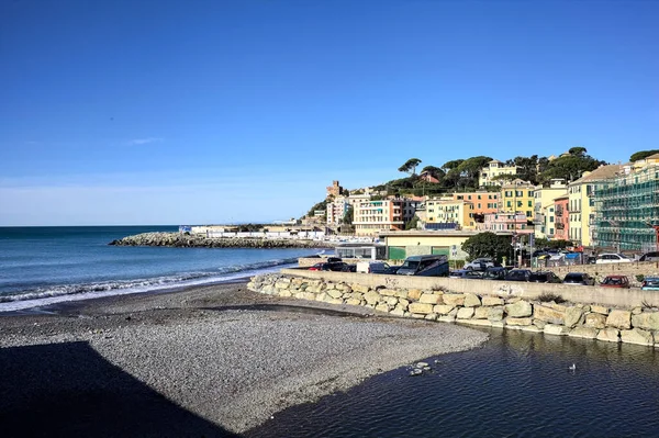 stock image Cliff with historic buildings that stretches into the sea seen from the distance on a clear day