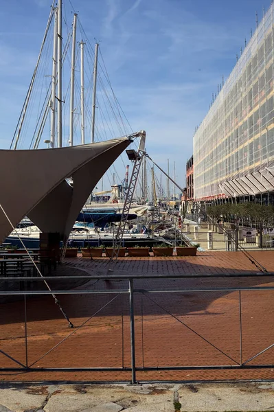 stock image Boulevard in a pier with docked boats on a sunny day