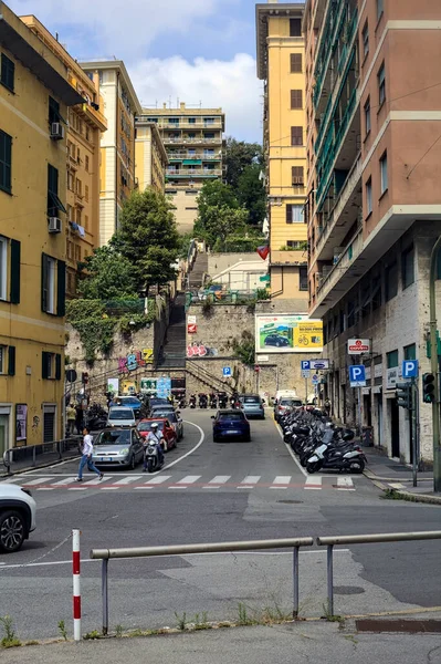 stock image Street with a stone staircase at the end of it in an italian city seen from the distance and framed by buildings