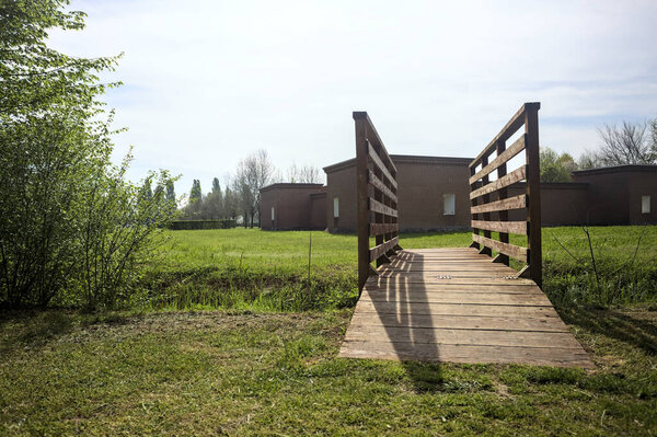 Small wooden bridge over a trench