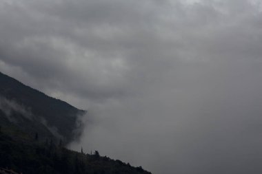 Mountain ridges during a rainfall clipart