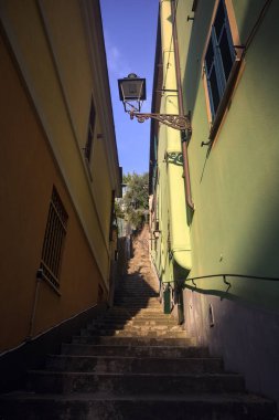 Steep staircase between walls clipart