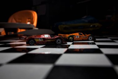 Mantova, İtalya - 29th APRIL 2025 - 1 / 64 Hot Wheels replicas of two Mazda 787B on a ışıltılı kontrol edilmiş folyo simülasyon simülasyonu