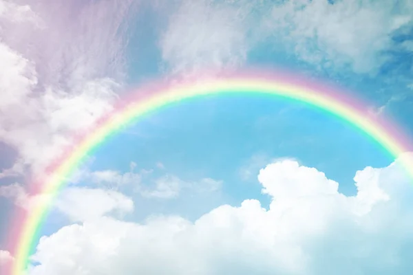 stock image rainbow on cloudy blue sky , beautiful fantasy sky