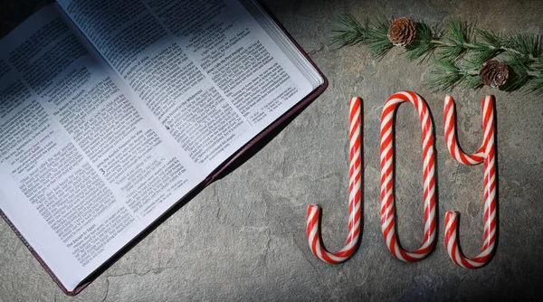 Open Bible Joy Written Candy Canes Stone Table — Stock Photo, Image