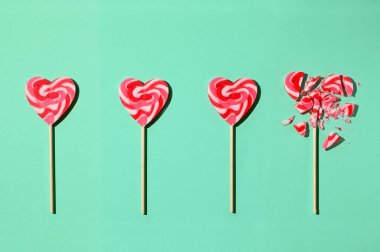 A Line Formation Lollipop In Shape Of Heart and Last One Broken