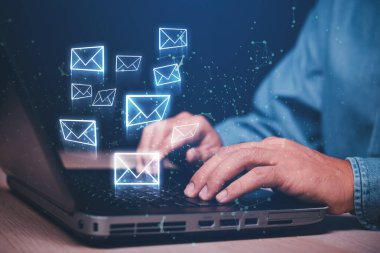 businessman working with laptop sending email on virtual screen, email marketing concept, sending mass e-mails or digital newsletter to manage relationship with customers