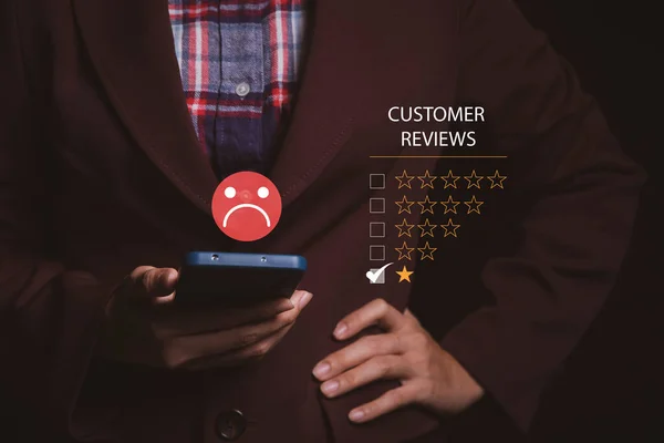 Customer Experience dissatisfied Concept, Unhappy Businessman Client with Sadness Emotion Face on smartphone screen, Bad review, bad service dislike bad quality, low rating, social media not good