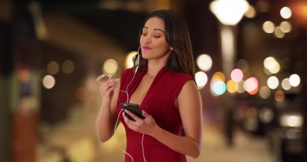 Cute Latina Female Wearing Red Dress Listening Music Cell Phone — Stock Video