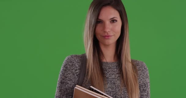 Smiling Millennial Woman Student Holding Books Wearing Grey Sweater Greenscreen — Stock Video
