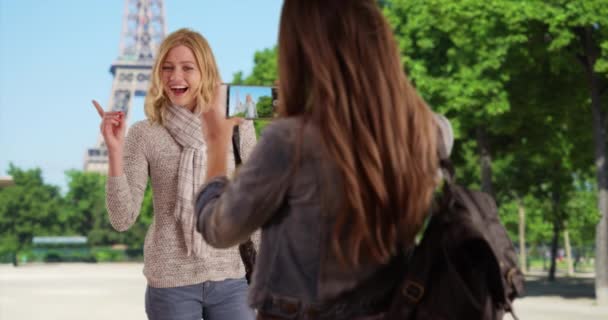 Charming Young Woman Taking Picture Friend Standing Front Eiffel Tower — Stock Video