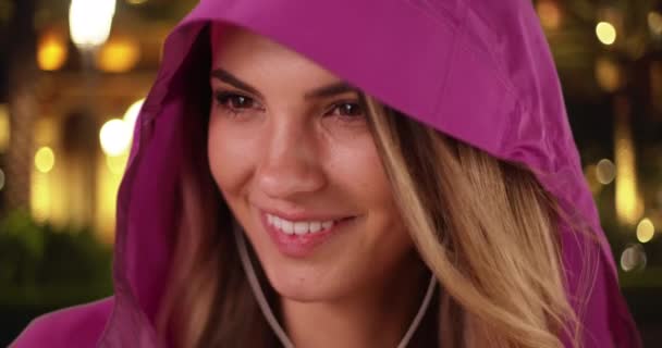 Close Attractive Millennial Girl Pink Rain Coat Listening Music Smiling — Stock Video