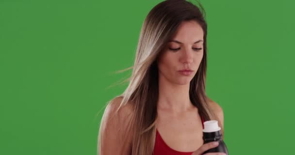 Close Millennial Woman Red Top Drinking Water Bottle Greenscreen Caucasian — Stock Video