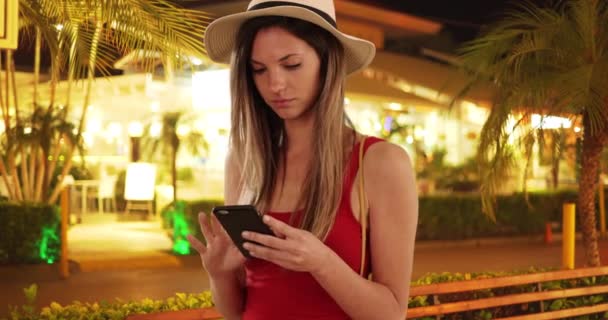 Stylish Woman Red Top Using Phone Looking While Tropical Vacation — Stock Video