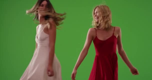 Couple Pretty Girls Twirling Dresses Laughing Green Screen Joyful Young — Stock Video