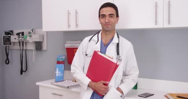 Charming Young Latino Doctor Standing Indoors Medical Office Looking Camera — Stock Video