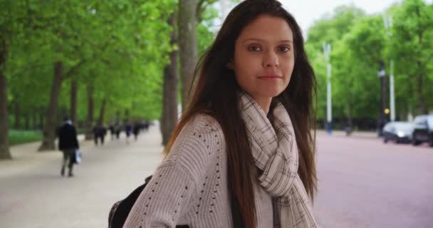 Beautiful Female Striped Scarf England Making Eye Contact While City — Stock Video