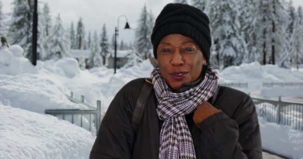 Elderly Black Woman Stands Outdoors Snow Smiling Camera Portrait Cute — Stock Video