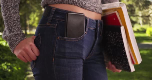 Close College Girl Carrying Books Phone Pocket Campus Tight Shot — Stock Video