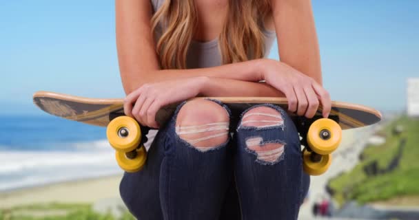 Closeup Young White Female Wearing Ripped Jeans Tank Top Sitting — Stock Video