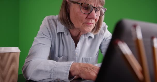 Close Senior Woman Typing Laptop Front Green Chromakey Composite Screen — Stock Video
