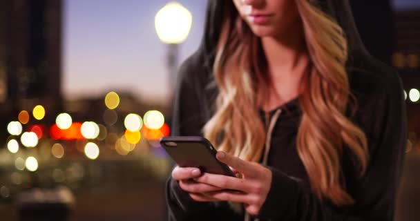 Close Millennial Girl Wearing Hoodie Texting Cellphone Downtown Evening Close — Stock Video