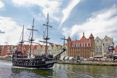Gdansk, Poland - august 9: a pleasure craft in the Gdansk canal on august 9, 2021 in Gdansk, Poland