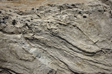 Taş yüzeyinin gri arkaplan dokusu yakın plan.