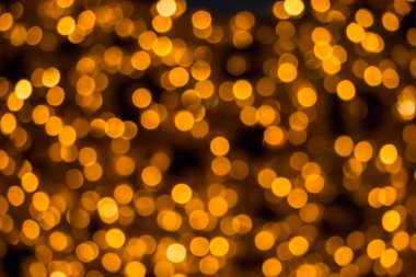 Soyut şenlik arka planı karanlıkta bulanık ışıklar