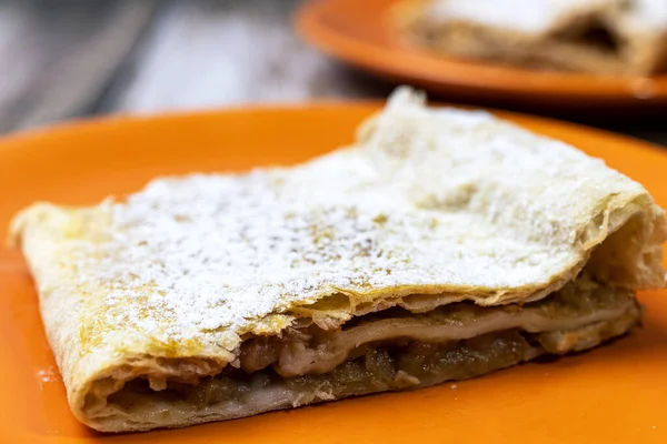 stock image Apple pie sprinkled with powdered sugar.