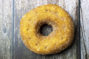 Cinnamon donut filled with apricot jam.