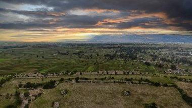 Hunuco: Pre-Incan Ruins Under the Dramatic Sky of the Peruvian Andes clipart