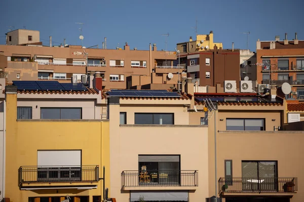 stock image Solar energy panels on the roofs of single-family homes, in Barcelona Spain. Horizontal