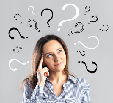 Confused young business woman with question marks above her hea